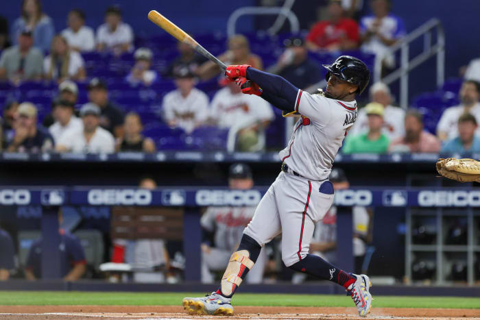 Sep 16, 2023; Miami, Florida, USA; Atlanta Braves second baseman Ozzie Albies (1) hits a two-run home run against the Miami Marlins during the first inning at loanDepot Park.